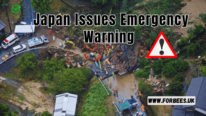 Aerial view of rescue workers in Japan as Typhoon Shanshan approaches with high winds and heavy rain.